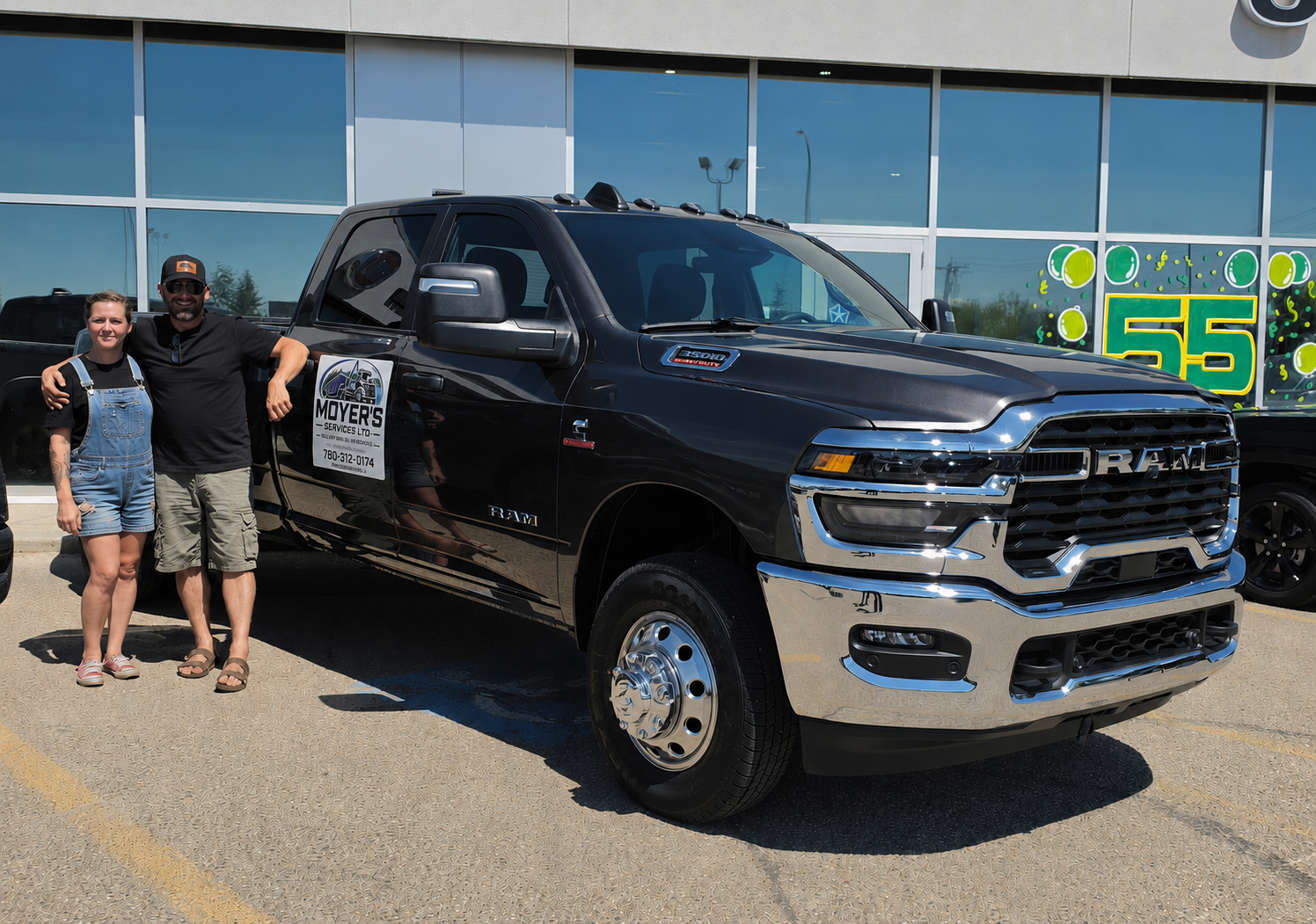 Kimberley Beson and Randy Moyer beside the Moyer's Services truck